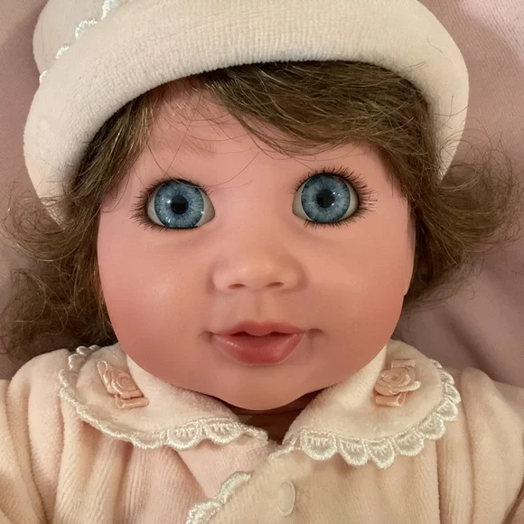 Adorable Baby Doll with Blue Eyes and Pink Outfit - Picture 2 of 7